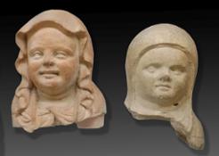 11  Teste di statue votive in terracotta di neonati in fasce