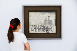 L.S. Lowry, Going to the Match, 1928, oil on canvas 17 by 21in. (est. £2,000,000-3,000,000) - in situ 6