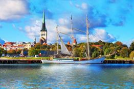 Scenic+summer+panorama+of+pier+with+historical+tall+sailing+ship+in+the+Old+Town+in+Tallinn,+Estonia