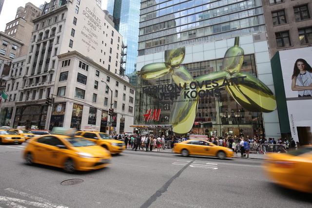 The largest H M store in the world opens on Fifth Avenue in NYC featuring a collaboration with iconic artist Jeff Koons